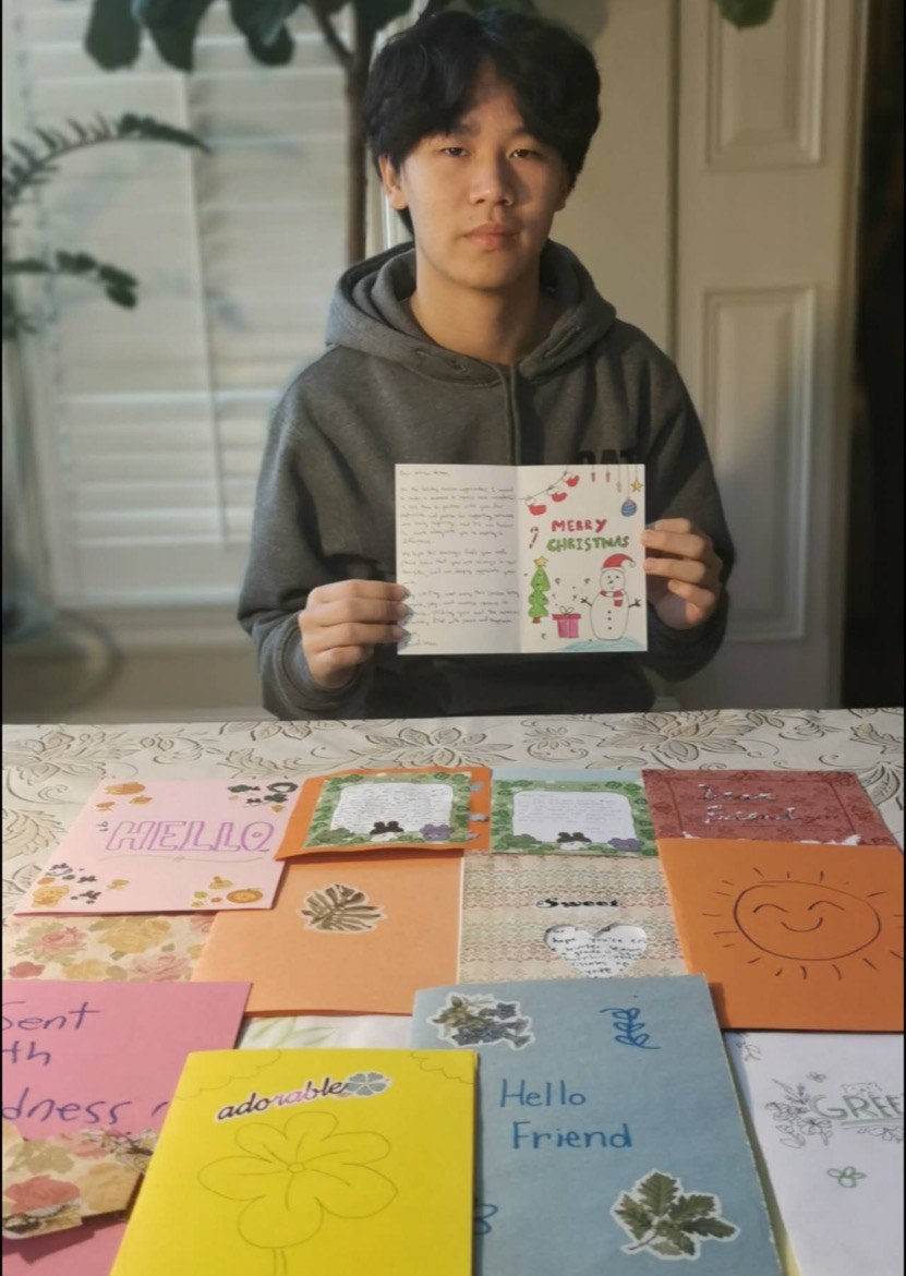 A student with letters of appreciation