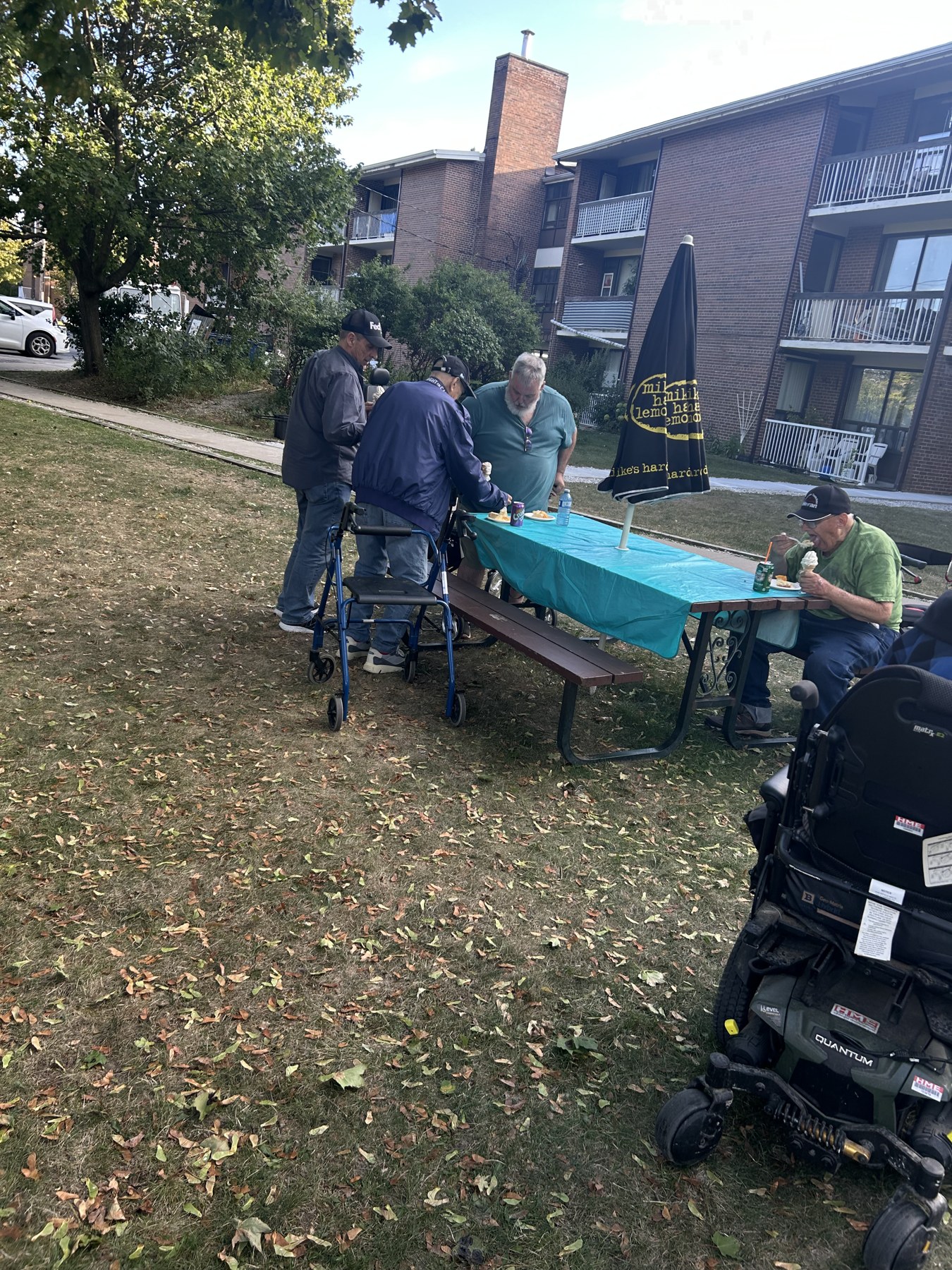 Veterans and volunteers gathered at an outdoor table