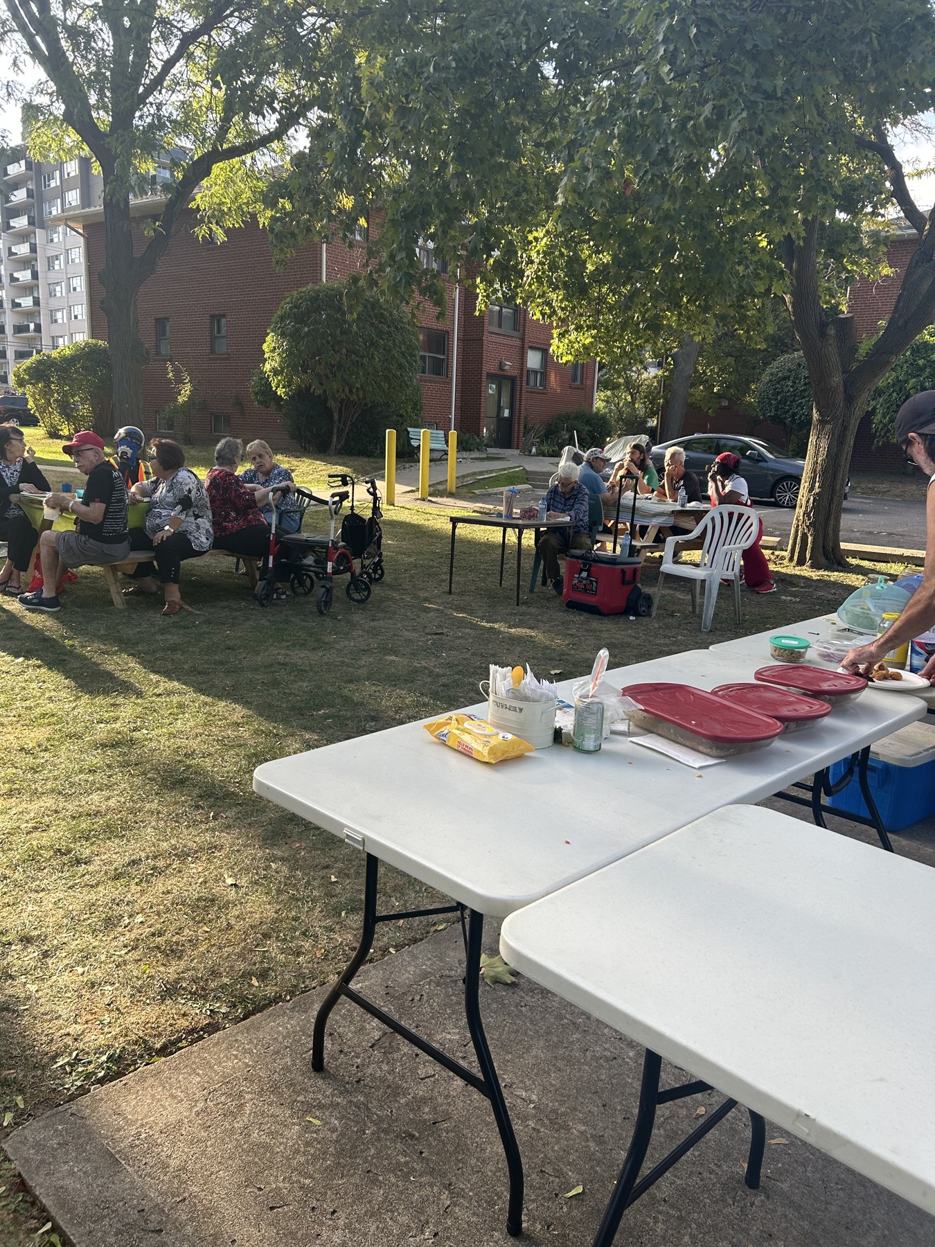 Participants and tables at a community barbecue